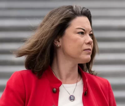 Man held after congresswoman pours hot coffee on assailant